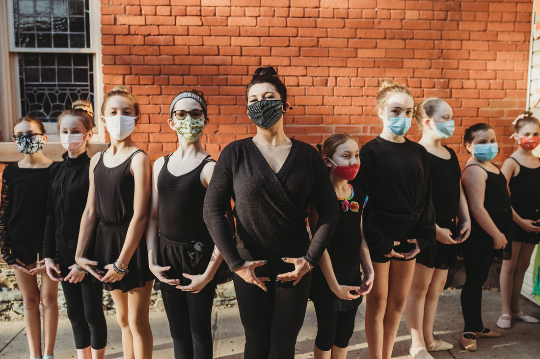 Signature Dance students lined up with Miss Meg outside the studio